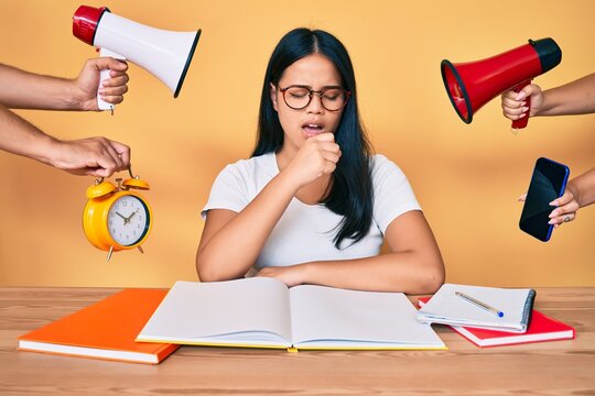 Young beautiful asian girl stuying for university getting stressed out feeling unwell and coughing as symptom for cold or bronchitis. health care concept.