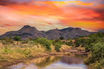 River in the great Karoo surounded by maintains and vegetation