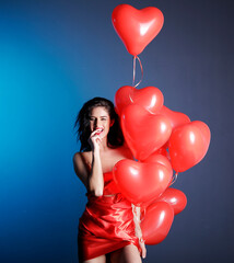 Fototapeta na wymiar Valentine Beauty girl with red air balloon portrait 