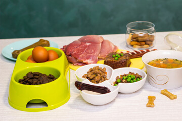 Preparing natural organic food for pets at home. Raw ingredients for pet food in bowl