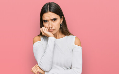 Young hispanic woman wearing casual clothes thinking looking tired and bored with depression problems with crossed arms.