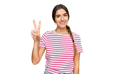 Young hispanic woman wearing casual clothes showing and pointing up with fingers number two while smiling confident and happy.