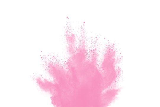 Freeze motion of pink color powder exploding on white background. © piyaphong