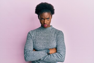 Young african american girl wearing casual clothes skeptic and nervous, disapproving expression on...