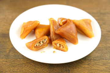 Traditional Turkish sweet pestil  muska dessert with walnut.