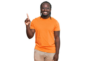 Handsome young african american man wearing casual clothes showing and pointing up with finger number one while smiling confident and happy.