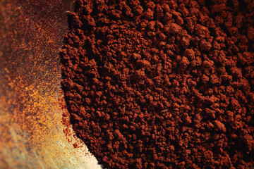 Close-up of instant coffee granules in a cup.