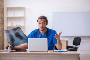 Young male doctor radiologist working in the clinic