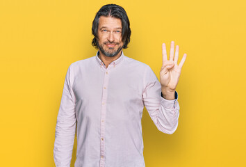 Middle age handsome man wearing business shirt showing and pointing up with fingers number four...