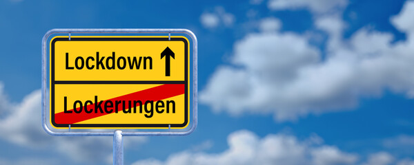 street sign showing the German message for leaving EASING and entering LOCKDOWN in front of a...
