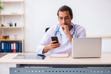 Young male doctor working in the clinic