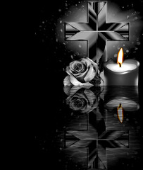 Rose, cross and candle on black background. Condolence card. Empty place for emotional, sentimental...