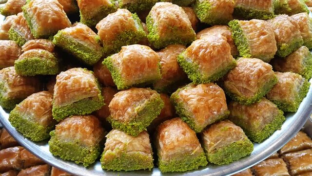 Baklava with pistachio and walnuts in a white plate