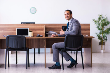 Young male employee working in the office