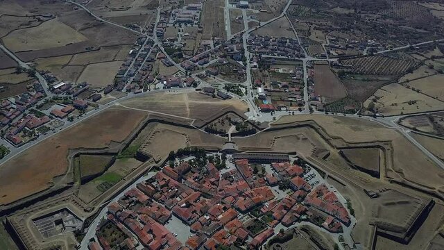 An aerial view of Almeida Fortress in the middle of a city in Portugal
