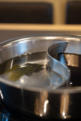 Two ways soup in on pot for Shabu Shabu