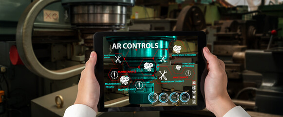 Engineer use augmented reality software in smart factory production line with automated application...