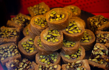 High angle shot of pistachio Burma baklava Turkish dessert stacked in a pile