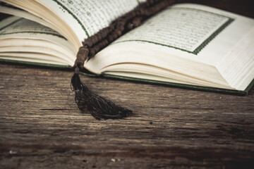 Koran - holy book of Muslims ( public item of all muslims ) on the table , still life .