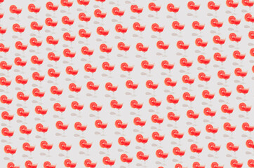 minimally lined cocktail glasses with a red drink.