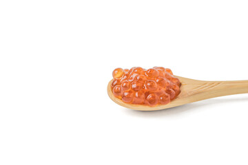 Spoon made of light wood with red caviar isolated on a white background.