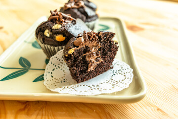 Chocolate muffins with crispy top.