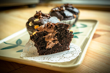 Chocolate muffins with crispy top.
