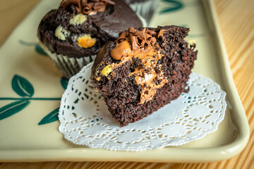 Chocolate muffins with crispy top.
