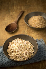 bowls of dried steel cut and rolled oats.
