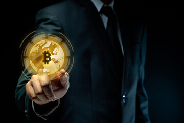 Close up shot of Businessman with bitcoin symbol hologram effect.