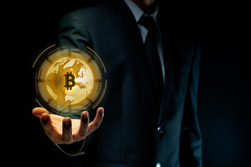 Close up shot of Businessman with bitcoin symbol hologram effect.