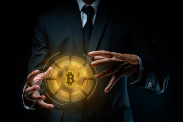 Close up shot of Businessman with bitcoin symbol hologram effect.