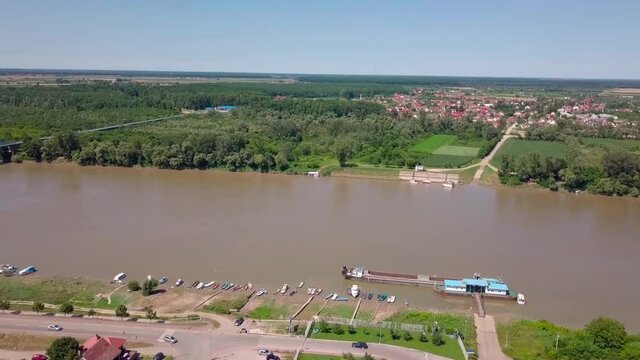 An aerial view of the buildings, roads, and water at the Brcko district, Bosnia and Herzegovina in HD