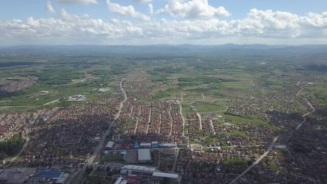 An aerial view of the buildings, roads, and water at the Brcko district, Bosnia and Herzegovina in HD