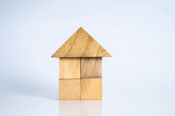 Obraz na płótnie Canvas Wooden cube with house shape.
