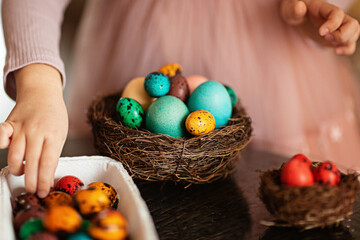 Cute little girl with Easter eggs on white background. Adorable child celebrate Easter holiday