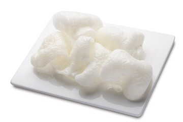 Rice chips or krupuk on white plate. File contains clipping path.