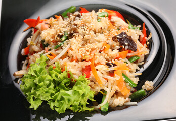 Rice salad with mushroom, vegetables and lettuce. Top view.