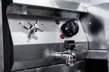 Commercial kitchen appliance temperature controls close up