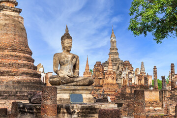 Buddha statue and pagoda Wat Mahathat temple, Sukhothai Historical Park, Thailand