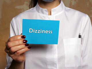 Healthcare concept meaning Dizziness with phrase on the piece of paper.