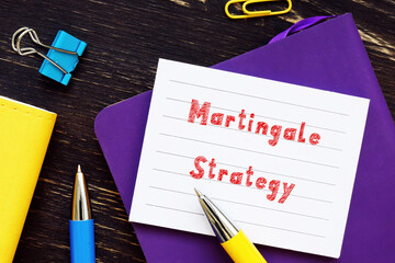  Martingale Strategy phrase on the piece of paper.