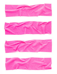 Crumpled pieces of pink fluorescent tape isolated on white background. Creased neon pink duct tape.