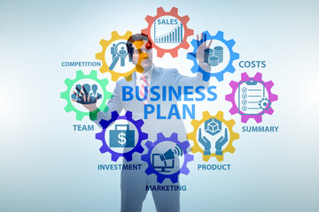 Business plan concept with businessman pressing button