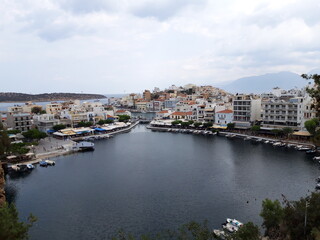 Fototapeta na wymiar Agios Nikolaos - CRETE City under the clouds 