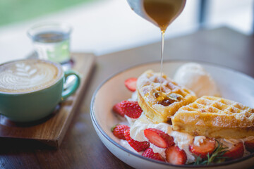waffle pancake desert with vanilla ice cream, fresh strawberry and honey syrup - 408016794
