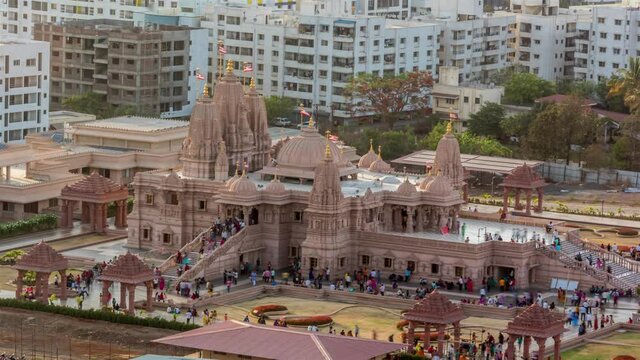 Time Lapse of People Visiting Hindu Temple in a City with Cityscape View in Background, Pune, Maharashtra, India