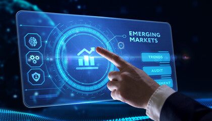 Business, Technology, Internet and network concept. Young businessman working on a virtual screen of the future and sees the inscription: Emerging markets