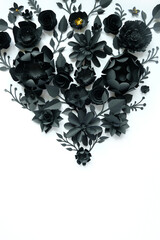 Black paper flowers on white background. Cut from paper.