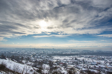 Panorama of a winter European city in the haze